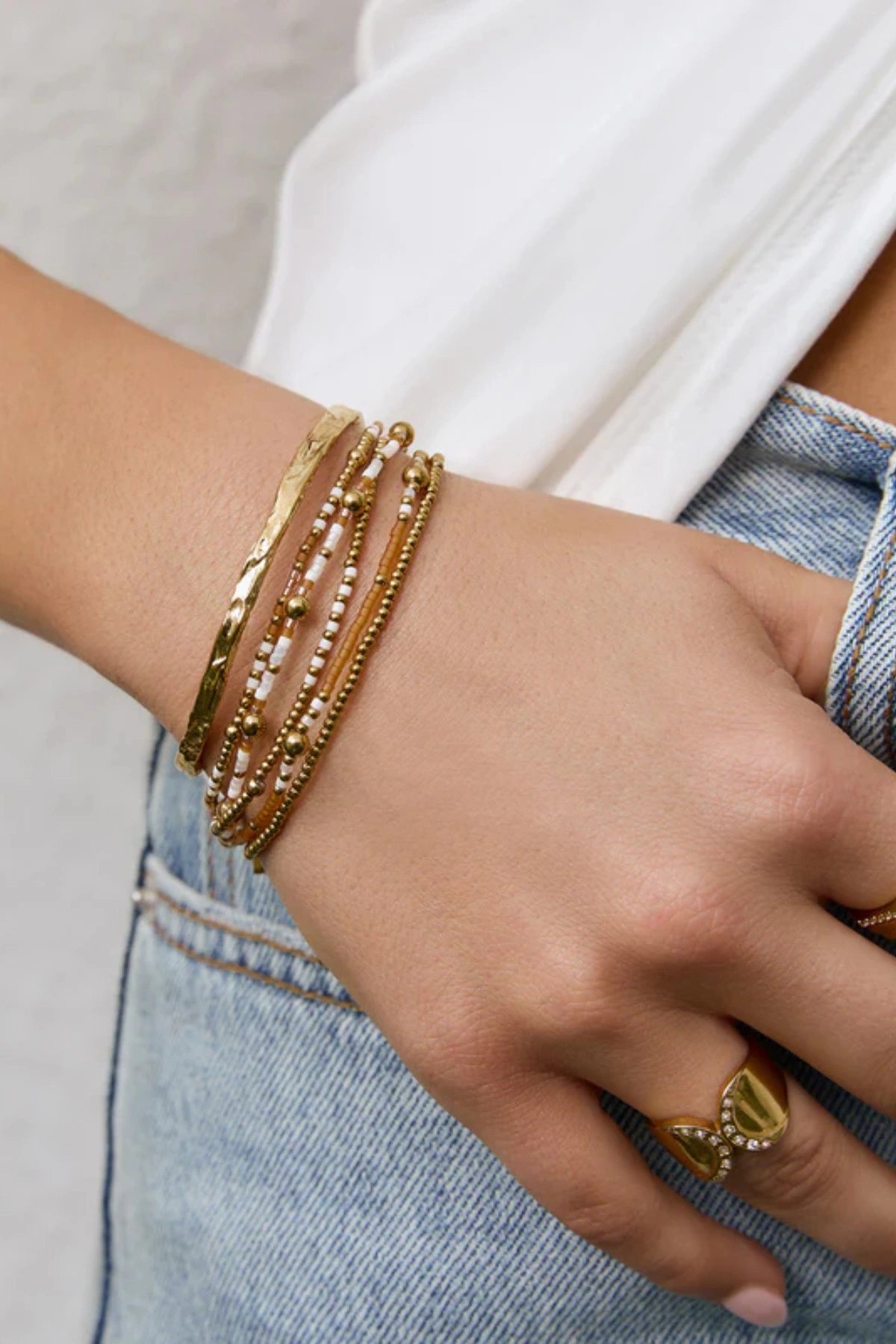 Nellie Bracelet Mango by Arms of Eve, vibrant beaded design with mango, white, and gold tones adding playful colour and chic sophistication.