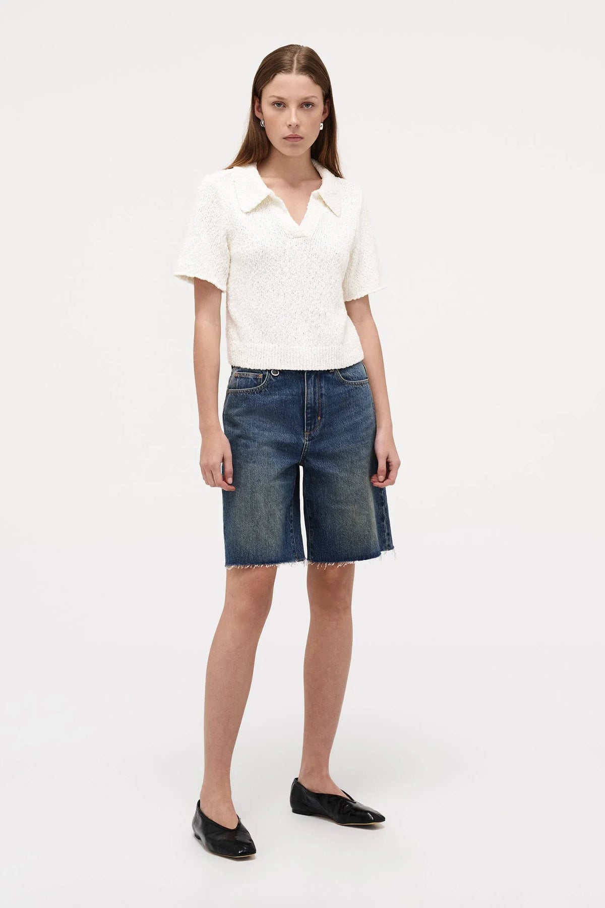 Neuw Denim Cecil Knit Polo in Espresso, cropped short sleeve knit tee with polo collar and ribbed hem finish.