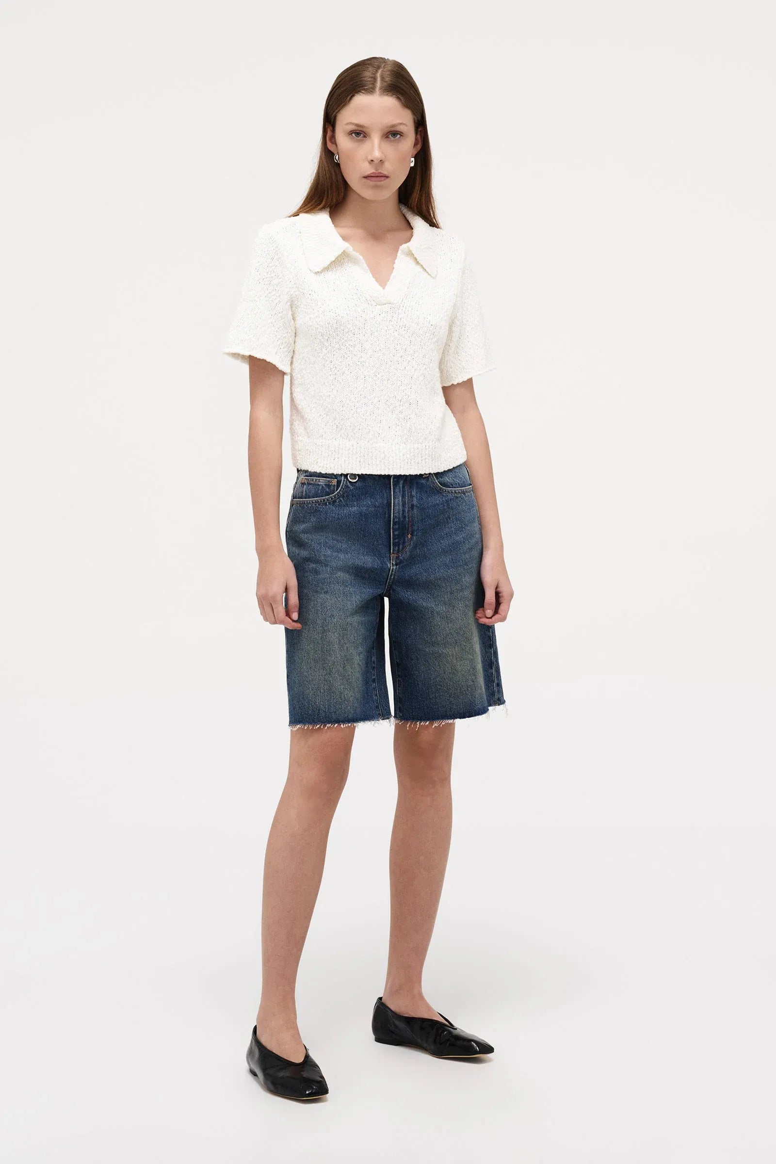 Neuw Denim Cecil Knit Polo in Espresso, cropped short sleeve knit tee with polo collar and ribbed hem finish.