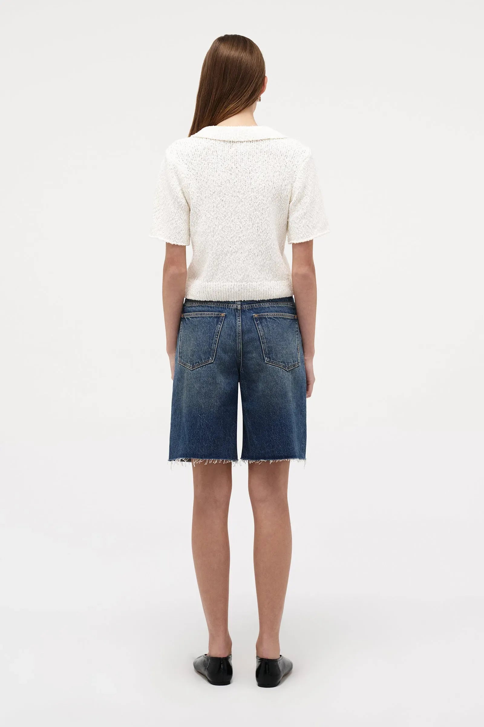 Neuw Denim Cecil Knit Polo in Espresso, cropped short sleeve knit tee with polo collar and ribbed hem finish.