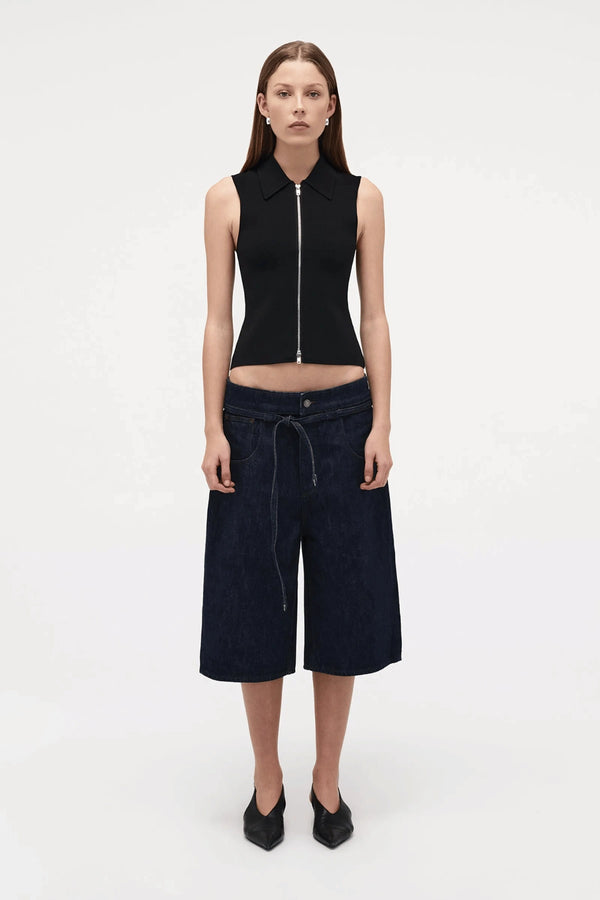 Neuw Denim Suki Zip Top in Black, a slim sleeveless knit with collared neckline and double zip closure. Perfect for modern minimalist styling.