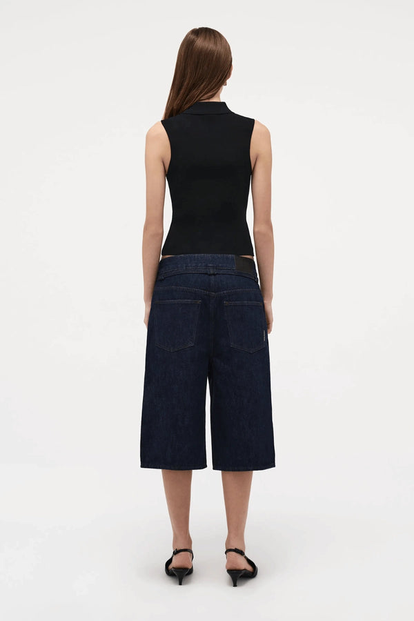 Neuw Denim Suki Zip Top in Black, a slim sleeveless knit with collared neckline and double zip closure. Perfect for modern minimalist styling.