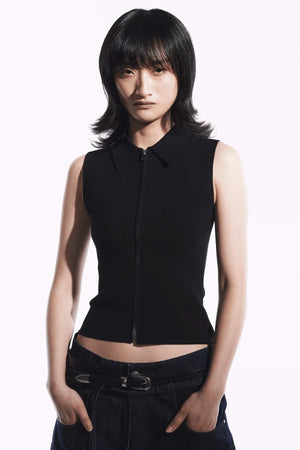 Neuw Denim Suki Zip Top in Black, a slim sleeveless knit with collared neckline and double zip closure. Perfect for modern minimalist styling.