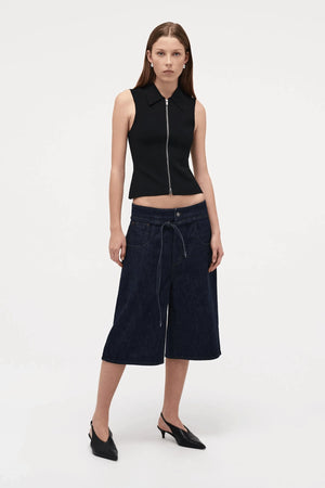 Neuw Denim Suki Zip Top in Black, a slim sleeveless knit with collared neckline and double zip closure. Perfect for modern minimalist styling.