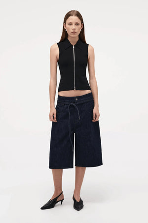 Neuw Denim Suki Zip Top in Black, a slim sleeveless knit with collared neckline and double zip closure. Perfect for modern minimalist styling.
