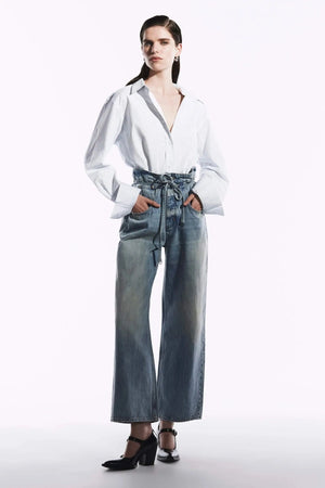 Neuw Denim Yoko Baggy Runway in light vintage indigo, wide-leg jeans with cinch waist feature and self-fabric belt.