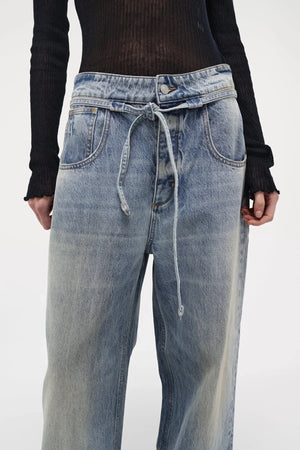 Neuw Denim Yoko Baggy Runway in light vintage indigo, wide-leg jeans with cinch waist feature and self-fabric belt.