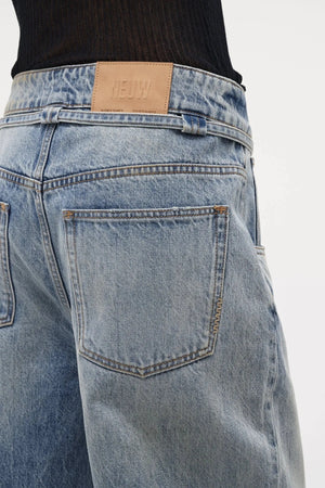 Neuw Denim Yoko Baggy Runway in light vintage indigo, wide-leg jeans with cinch waist feature and self-fabric belt.