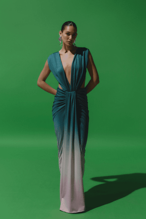 Nia Dress Mantis Green by Baobab – Trendy maxi with deep V-neck, open back, ruched shiny fabric, and side cutouts, perfect for making a bold, elegant statement at special events.