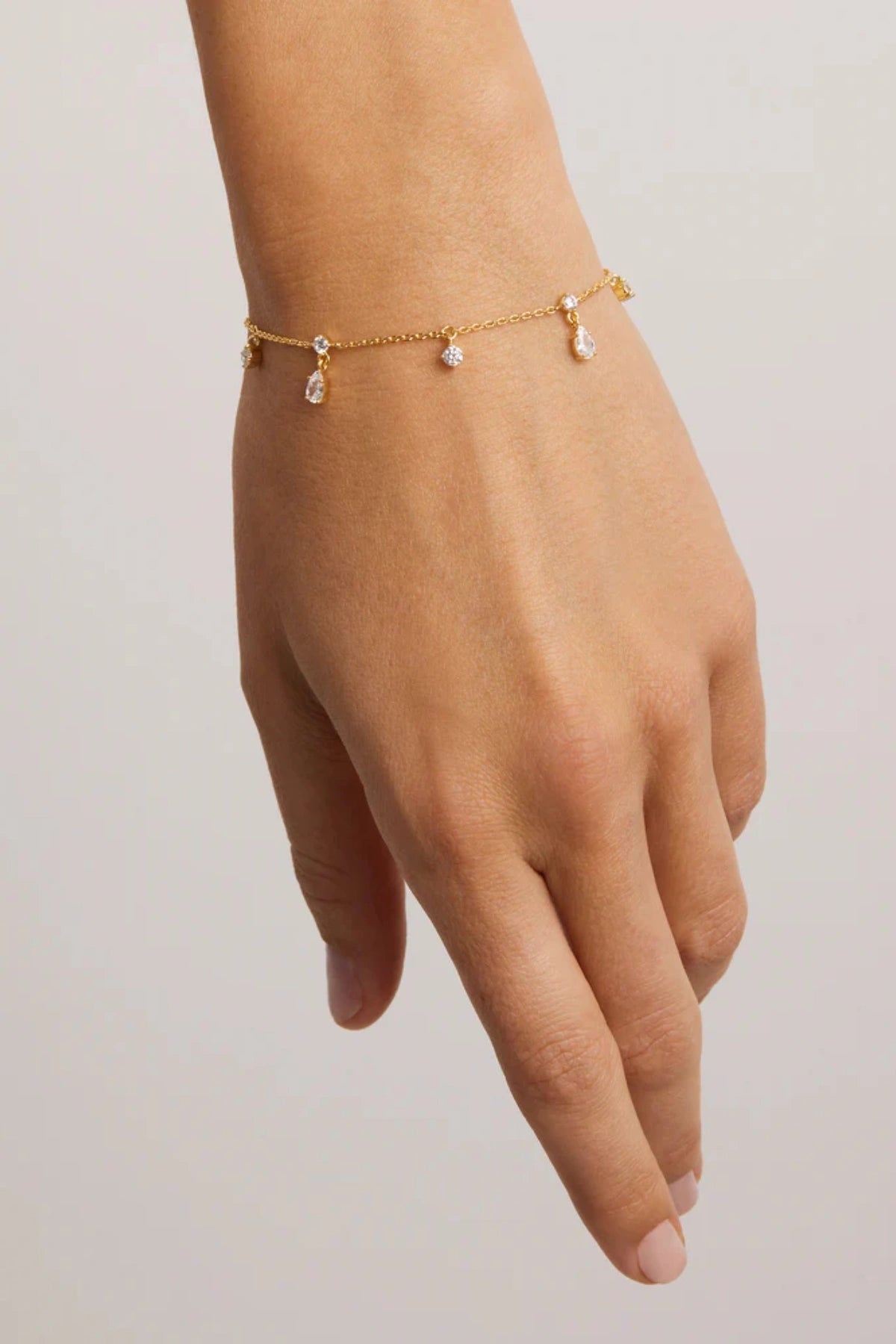No Rain, No Flowers Bracelet by By Charlotte, 18k gold vermeil fine chain bracelet with dewdrop cubic zirconias.
