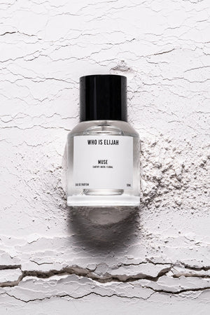 Muse 50ml by Who Is Elijah, a captivating unisex fragrance with tropical solar top notes, warm jasmine heart, and a musky, amberwood base.