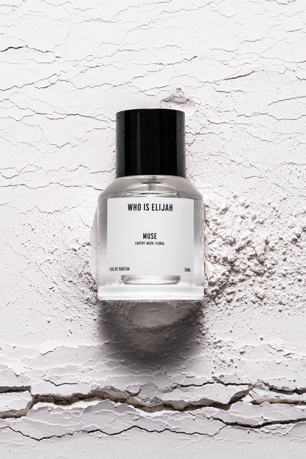 Muse 50ml by Who Is Elijah, a captivating unisex fragrance with tropical solar top notes, warm jasmine heart, and a musky, amberwood base.