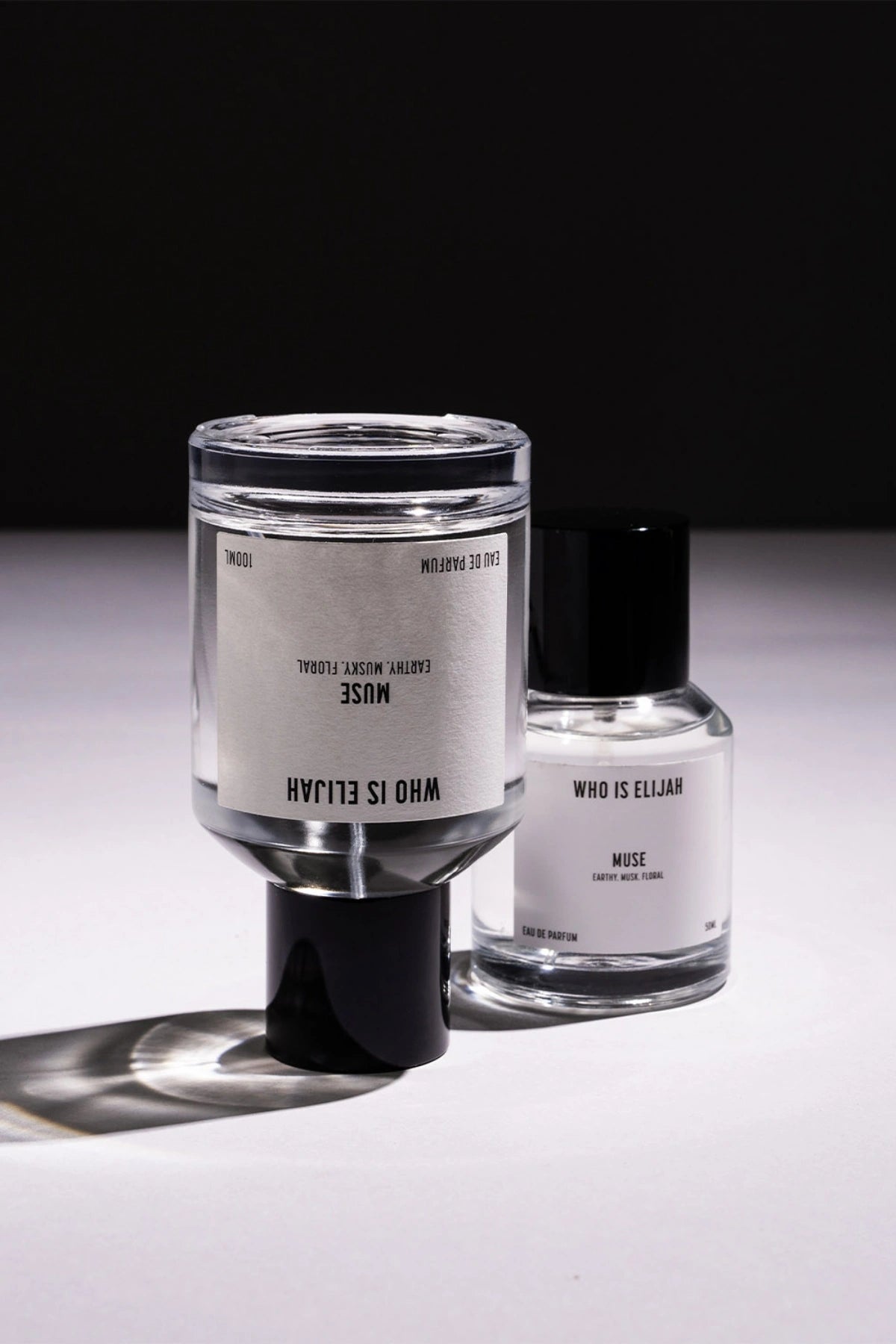 Muse 50ml by Who Is Elijah, a captivating unisex fragrance with tropical solar top notes, warm jasmine heart, and a musky, amberwood base.