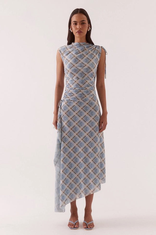 Novalyn Plaid Dress Check by Sovere, plaid midi dress with draped neckline and side tie detail. Perfect for elevated day to night styling.