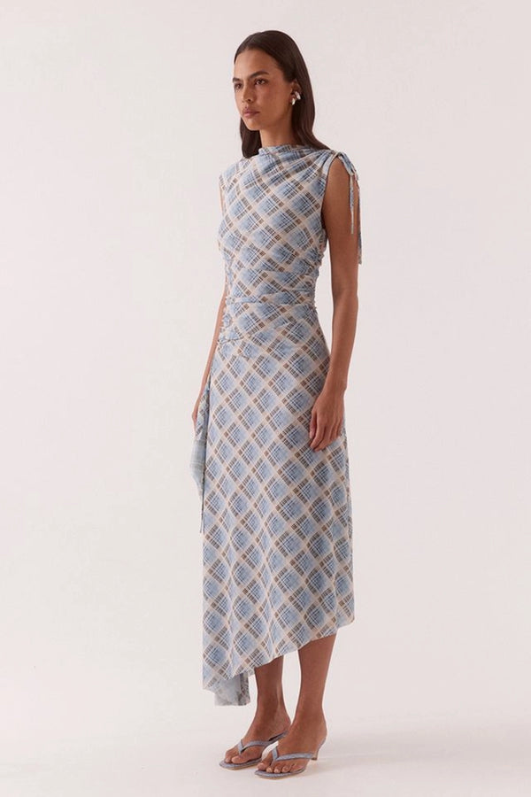 Novalyn Plaid Dress Check by Sovere, plaid midi dress with draped neckline and side tie detail. Perfect for elevated day to night styling.