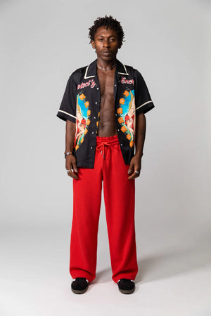 Red Knitted Baggy Pants by Something Very Special, featuring stripe jacquard and tonal embroidery. Unisex fit for everyday comfort.