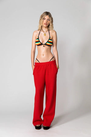 Red Knitted Baggy Pants by Something Very Special, featuring stripe jacquard and tonal embroidery. Unisex fit for everyday comfort.