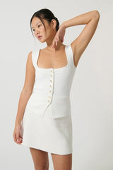 Margarita Top White by Onte, slim-fitting Milano knit tank with wide straps and square neckline, featuring tonal buttons, perfect for trendy viral chic and versatile layering.