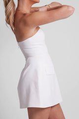 The Ultimate Muse Strapless Dress White by Odd Muse – Summer-ready strapless dress with corset top and voluminous skirt.