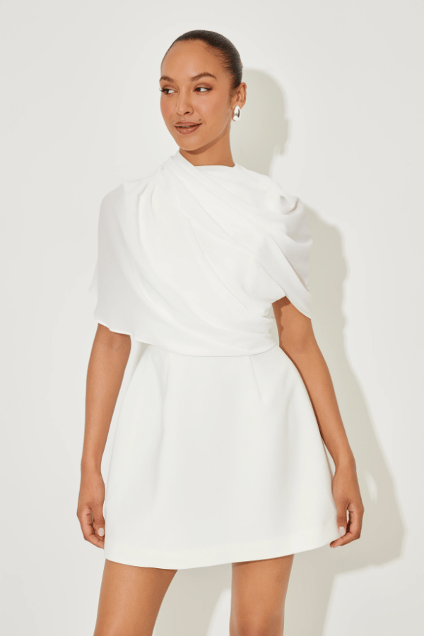 Ultimate Muse Gathered Mini Dress White by Odd Muse, a mesh-draped silhouette with open back and wrap detail. Perfect for modern bridal moments.