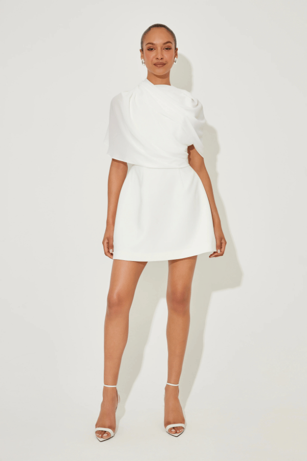 Ultimate Muse Gathered Mini Dress White by Odd Muse, a mesh-draped silhouette with open back and wrap detail. Perfect for modern bridal moments.