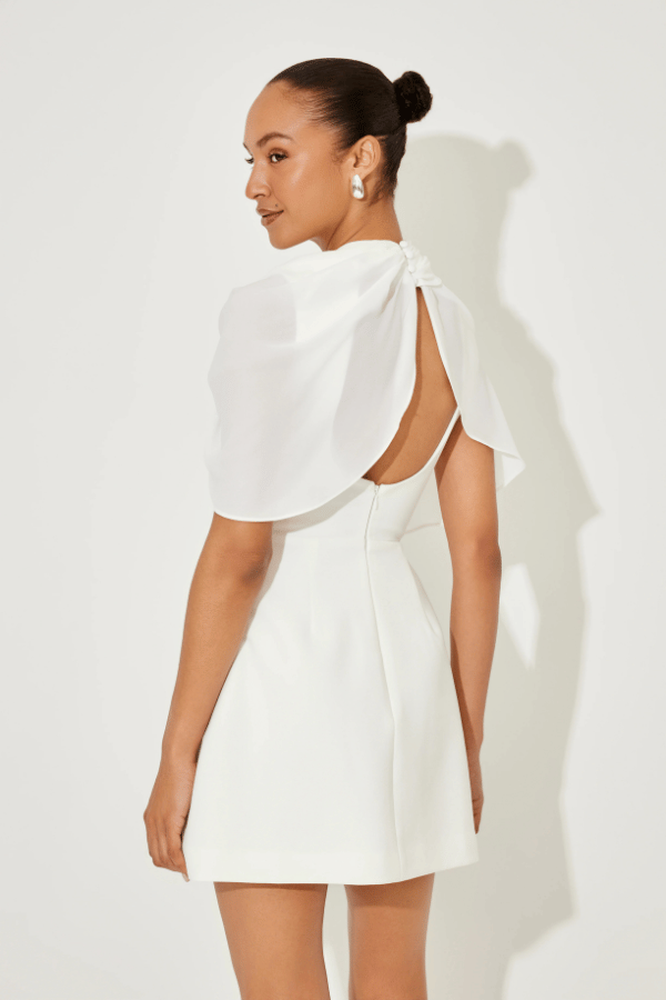 Ultimate Muse Gathered Mini Dress White by Odd Muse, a mesh-draped silhouette with open back and wrap detail. Perfect for modern bridal moments.