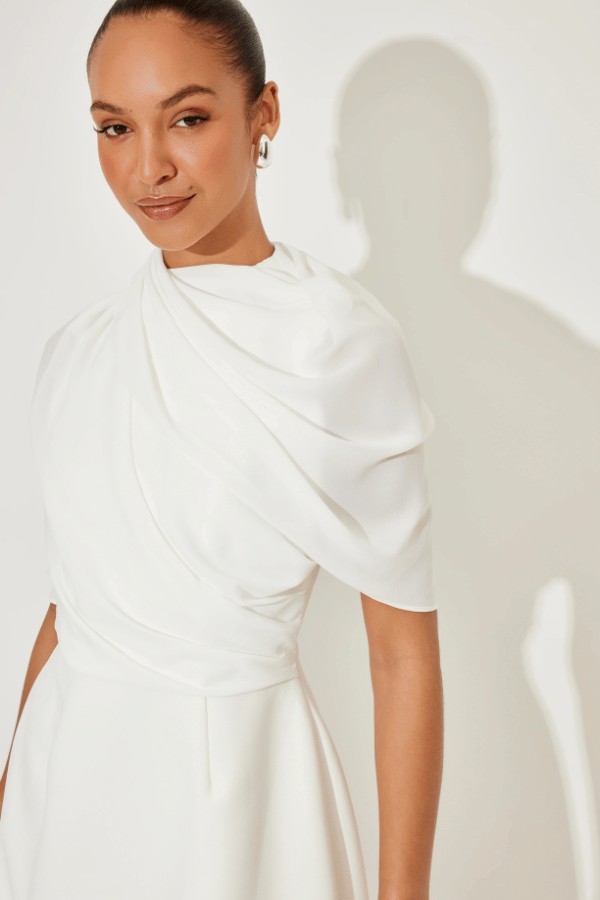Ultimate Muse Gathered Mini Dress White by Odd Muse, a mesh-draped silhouette with open back and wrap detail. Perfect for modern bridal moments.