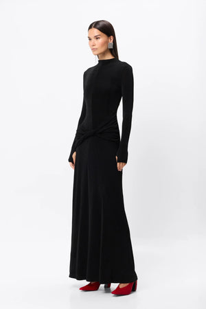 Ode Maxi Dress Black by Mossman – lustrous stretch jersey maxi dress with asymmetric twist waist and long sleeves.