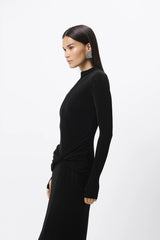 Ode Maxi Dress Black by Mossman – lustrous stretch jersey maxi dress with asymmetric twist waist and long sleeves.