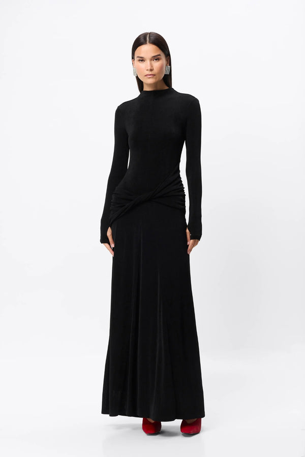 Ode Maxi Dress Black by Mossman – lustrous stretch jersey maxi dress with asymmetric twist waist and long sleeves.