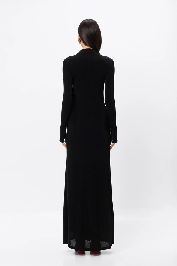 Ode Maxi Dress Black by Mossman – lustrous stretch jersey maxi dress with asymmetric twist waist and long sleeves.