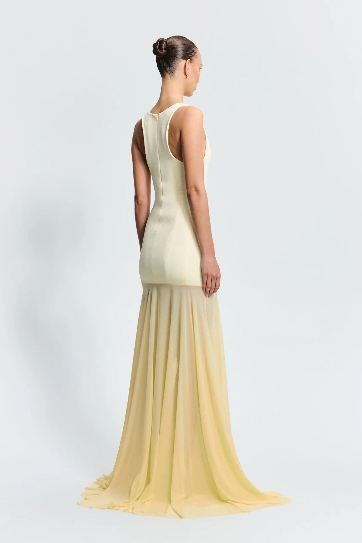 Odessa Gown in Lemon by Effie Kats, a sleek boned crepe bodice with sheer mesh skirt. Perfect for galas or formal evening celebrations.