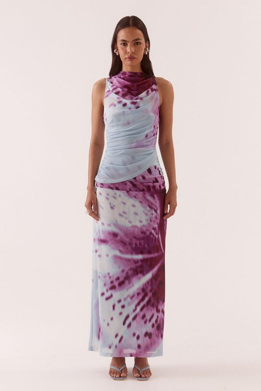 Odette Dress Blue Orchid by Sovere, printed maxi dress with draped detail and fitted silhouette. Perfect for events or standout styling.
