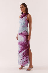 Odette Dress Blue Orchid by Sovere, printed maxi dress with draped detail and fitted silhouette. Perfect for events or standout styling.