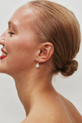 Odette Pearl Earrings by Heaven Mayhem – gold hook earrings with luminous pearl drops, perfect for timeless everyday elegance.