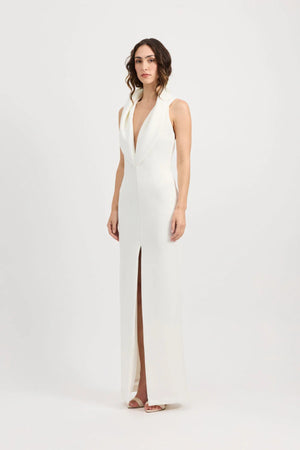 Odora Dress in Ivory by Tojhà, a sculpted halter maxi in lightweight scuba with plunging neckline, front split, and low back for modern allure.