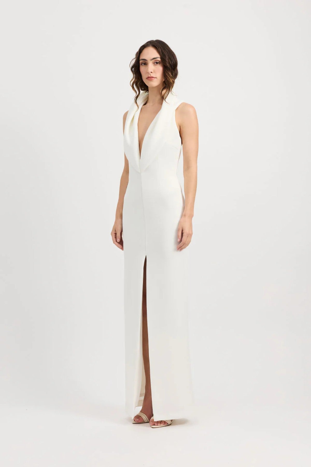 Odora Dress in Ivory by Tojhà, a sculpted halter maxi in lightweight scuba with plunging neckline, front split, and low back for modern allure.