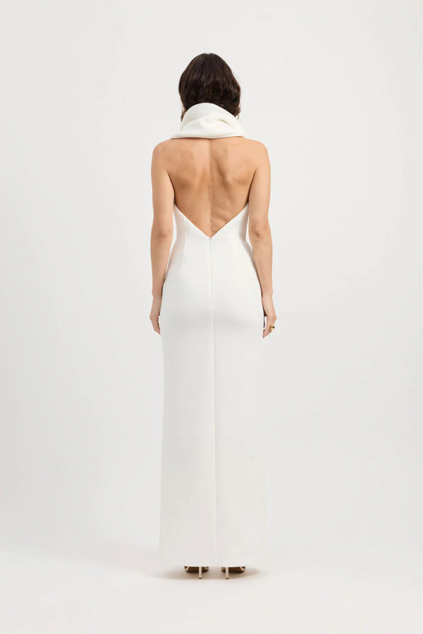 Odora Dress in Ivory by Tojhà, a sculpted halter maxi in lightweight scuba with plunging neckline, front split, and low back for modern allure.