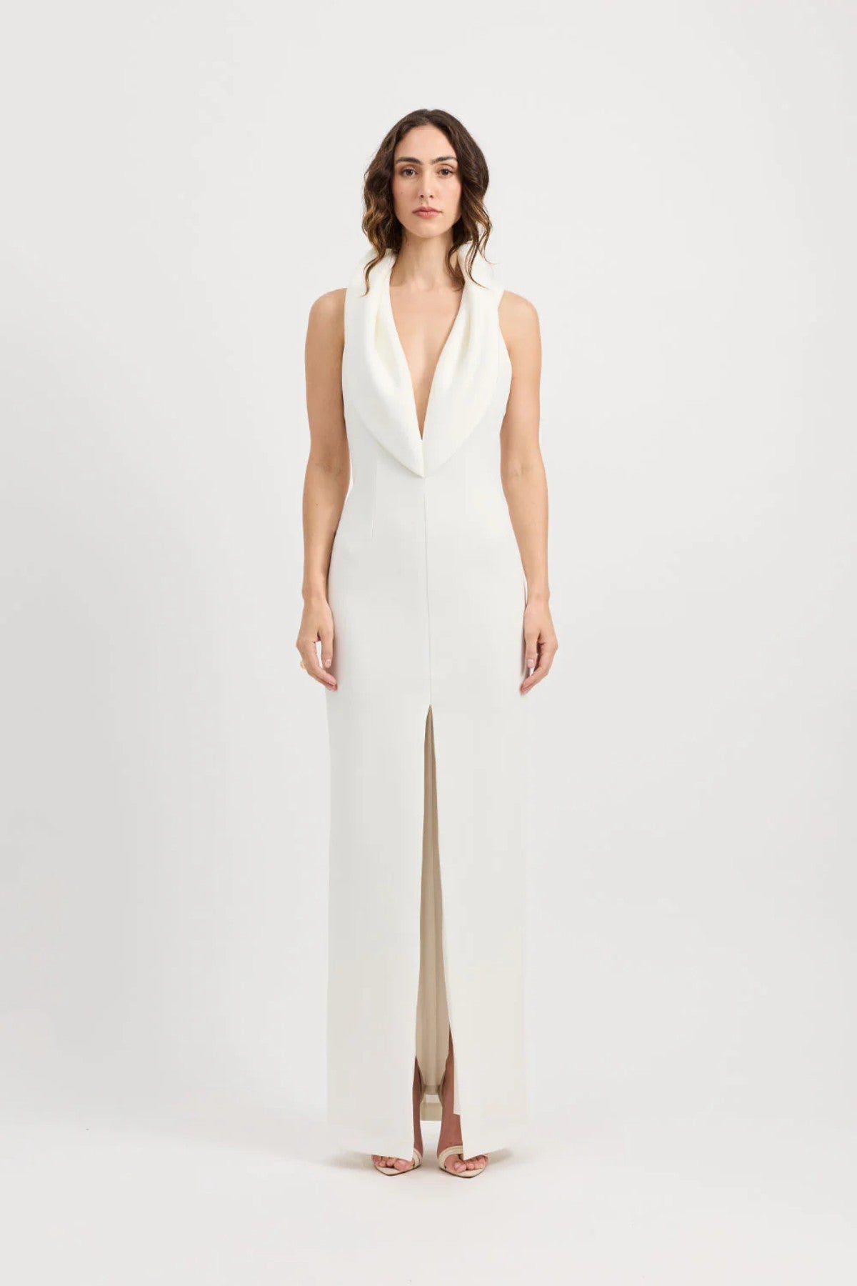 Odora Dress in Ivory by Tojhà, a sculpted halter maxi in lightweight scuba with plunging neckline, front split, and low back for modern allure.