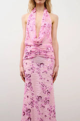 Olena Dress in Pink Floral Beaded by DŽO, a full-length embellished mesh gown with cowl neckline, ruched waist, and subtle train.