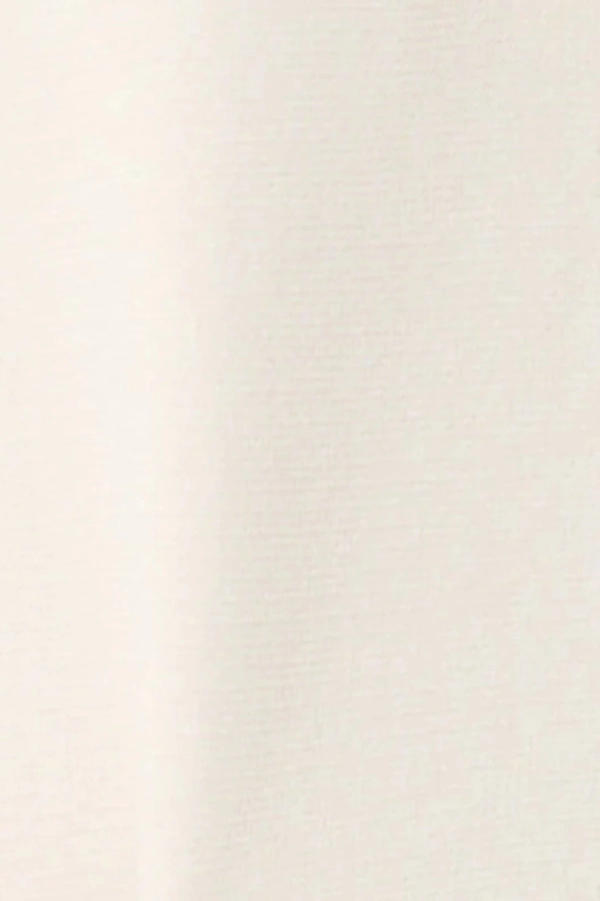 Onte Abril Top in ivory crepe knit with contrast navy and red trim, half zip, and boxy short-sleeve silhouette.
