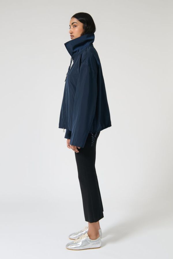 Onte Adela Windbreaker in Navy, oversized water-resistant jacket with funnel neck, paracord drawstrings, and two-ended silver zips.