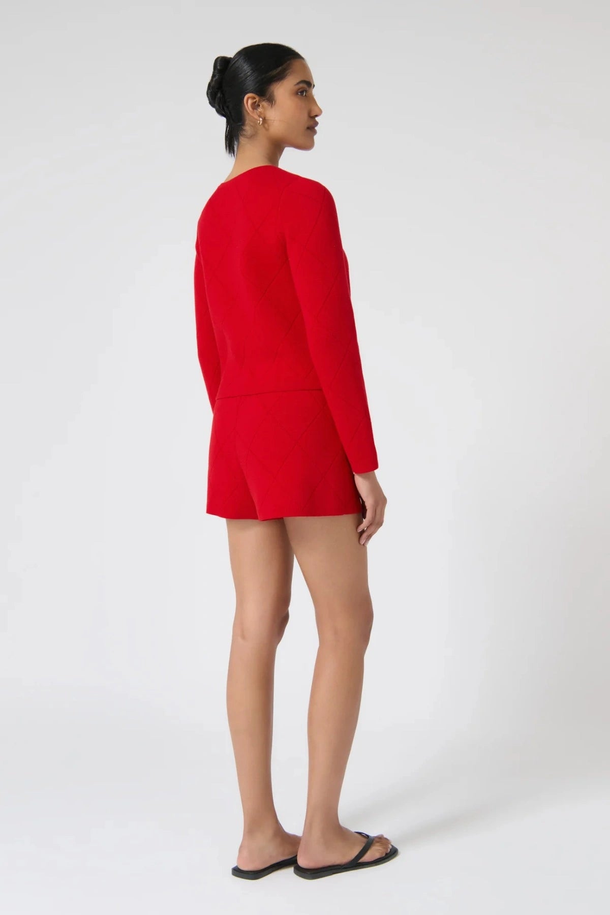 Onte Aldara Cardigan in red cotton with diamond pointelle knit, boxy fit, long sleeves, and self-covered buttons.