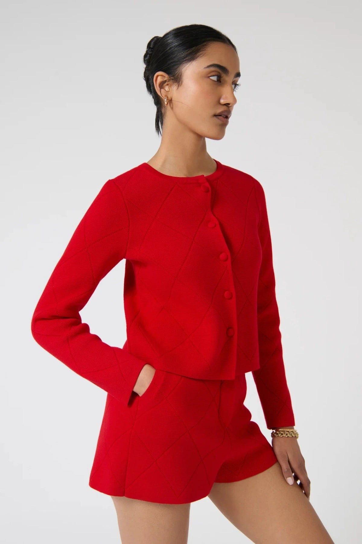 Onte Aldara Cardigan in red cotton with diamond pointelle knit, boxy fit, long sleeves, and self-covered buttons.