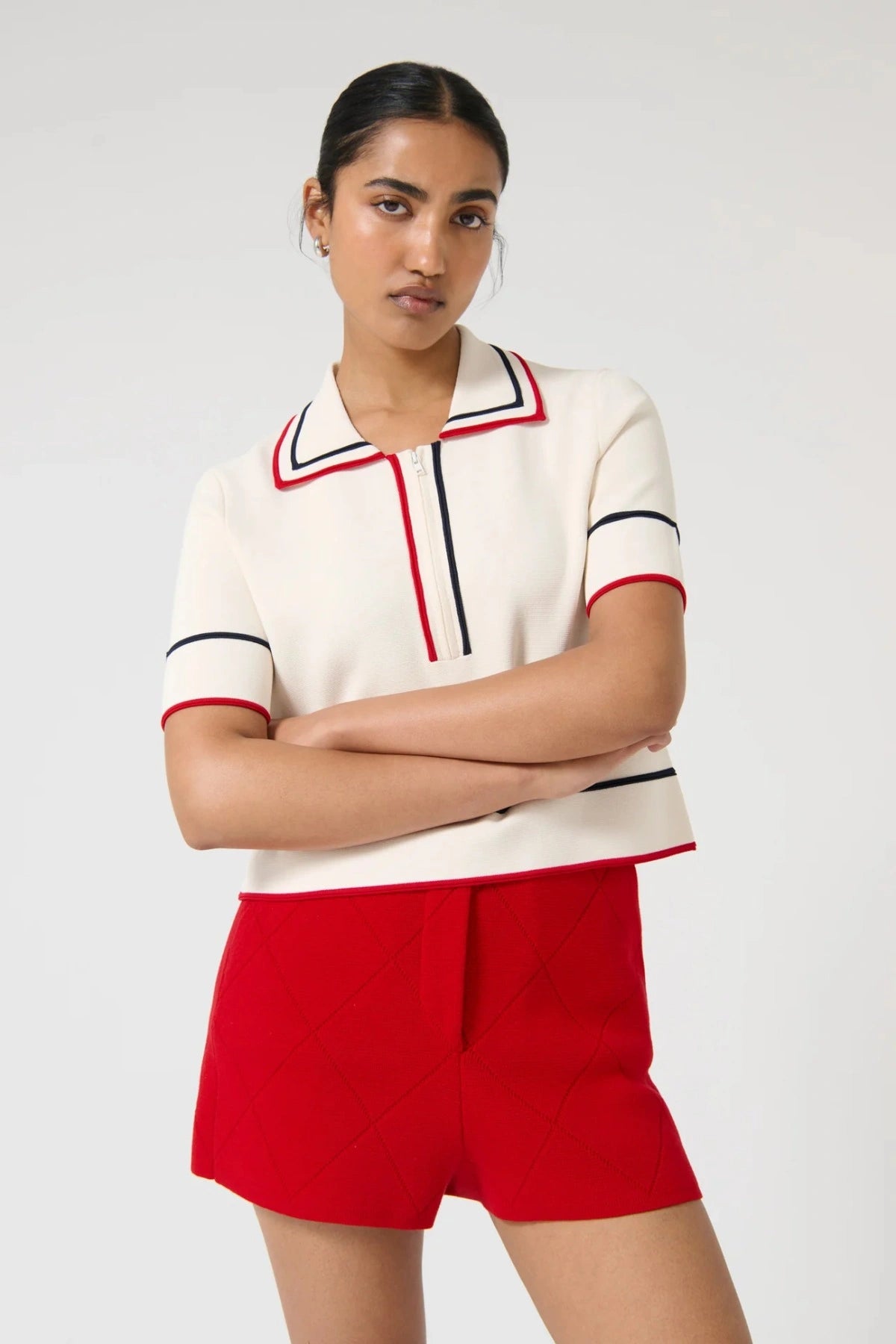 Onte Aldara Shorts in red cotton with diamond pointelle knit, mini length, and slight A-line fit.
