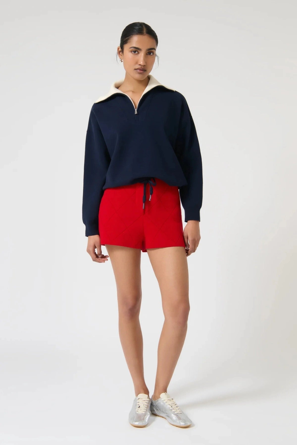 Onte Aldara Shorts in red cotton with diamond pointelle knit, mini length, and slight A-line fit.
