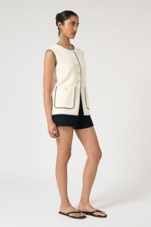 Onte Helena Gilet in Trim, crochet-style sleeveless knit with enamel gold buttons and patch pockets, a relaxed layer for polished styling.