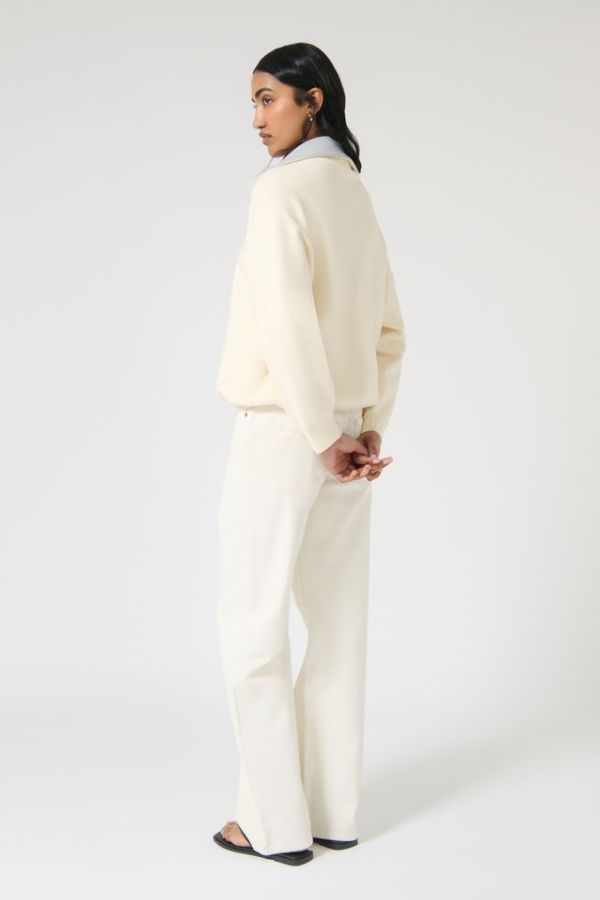 Onte Nerea Sweater in Ivory/Grey, soufflé knit with two-tone collar, half zip, silver hardware, and drawstring waist for versatility.