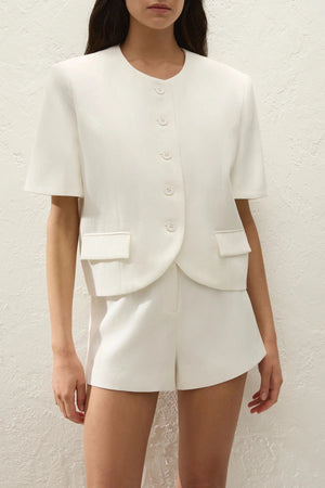 Orsa Blazer Off White by Faithfull the Brand - cropped linen blend blazer with short sleeves and oversized fit, perfect for modern summer suiting.