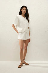 Orsa Blazer Off White by Faithfull the Brand - cropped linen blend blazer with short sleeves and oversized fit, perfect for modern summer suiting.
